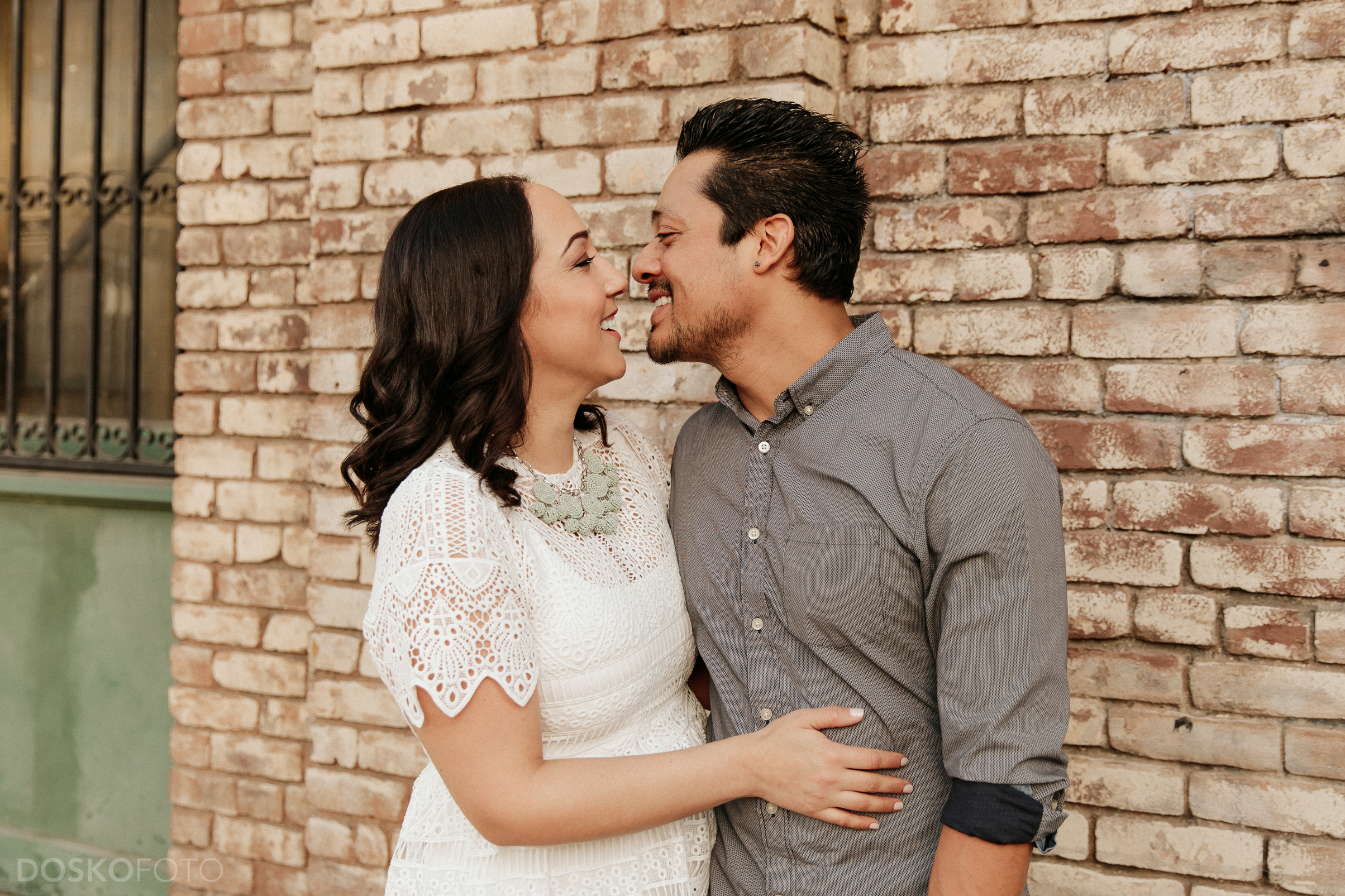 Amanda Doskocil (DOSKOFOTO), a Long Beach Wedding Photographer, travels downtown with Luis and Suzanne for an urban Los Angeles engagement photoshoot at the Nate Starkman &amp; Son building.